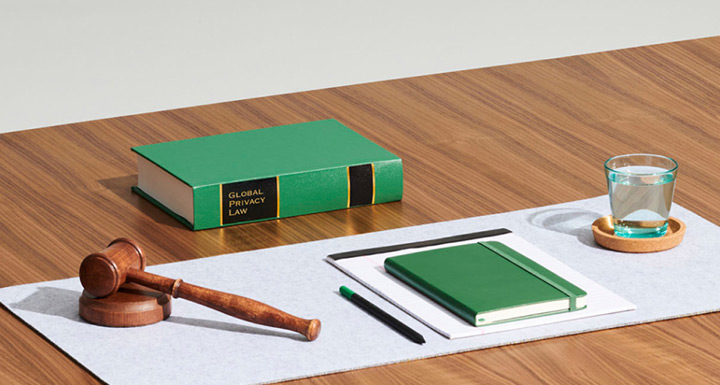 Desk with gavel, notebook and law book