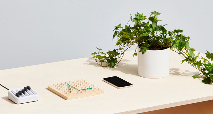 Desk with phone and potted plant